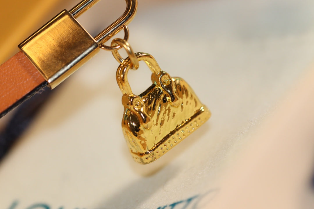 LV ALMA PINK GOLD CANVAS