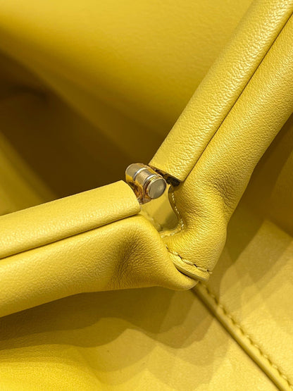 TRIANGLE HANDLE BAG 31 IN DANDELION YELLOW LAMBSKIN