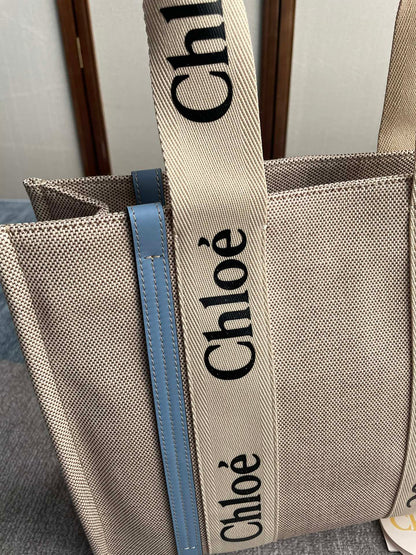 MEDIUM STRAP WOODY TOTE BAG 37 IN BEIGE LINEN CANVAS BLACK WEBBING LOGO EMBROIDER BLUE CALFSKIN