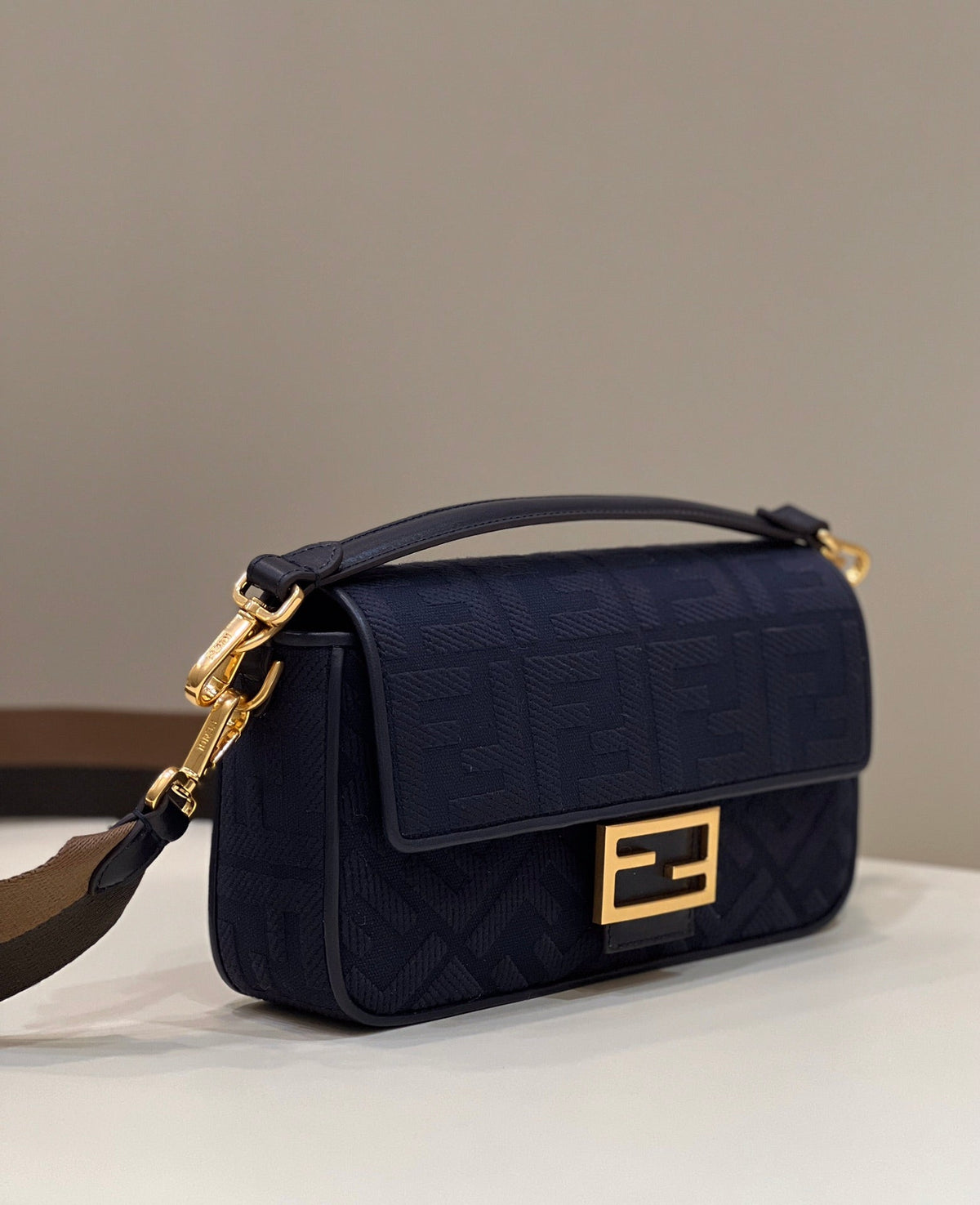BAGUETTE WITH FF MOTIF 27 IN NAVY BLUE JACQUARD FABRIC GOLD HARDWARE