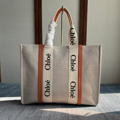 LAGRE WOODY TOTE BAG 45 IN BEIGE LINEN CANVAS BLACK WEBBING LOGO EMBROIDER ORANGE CALFSKIN