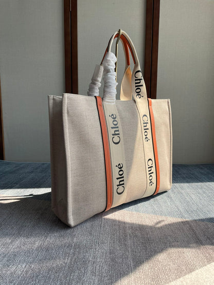LAGRE WOODY TOTE BAG 45 IN BEIGE LINEN CANVAS BLACK WEBBING LOGO EMBROIDER ORANGE CALFSKIN