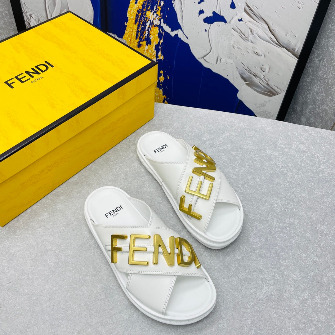 FENDI GRAPHY LOGO LETTERING SLIDES IN WHITE LAMBSKIN WITH GOLD HARDWARE