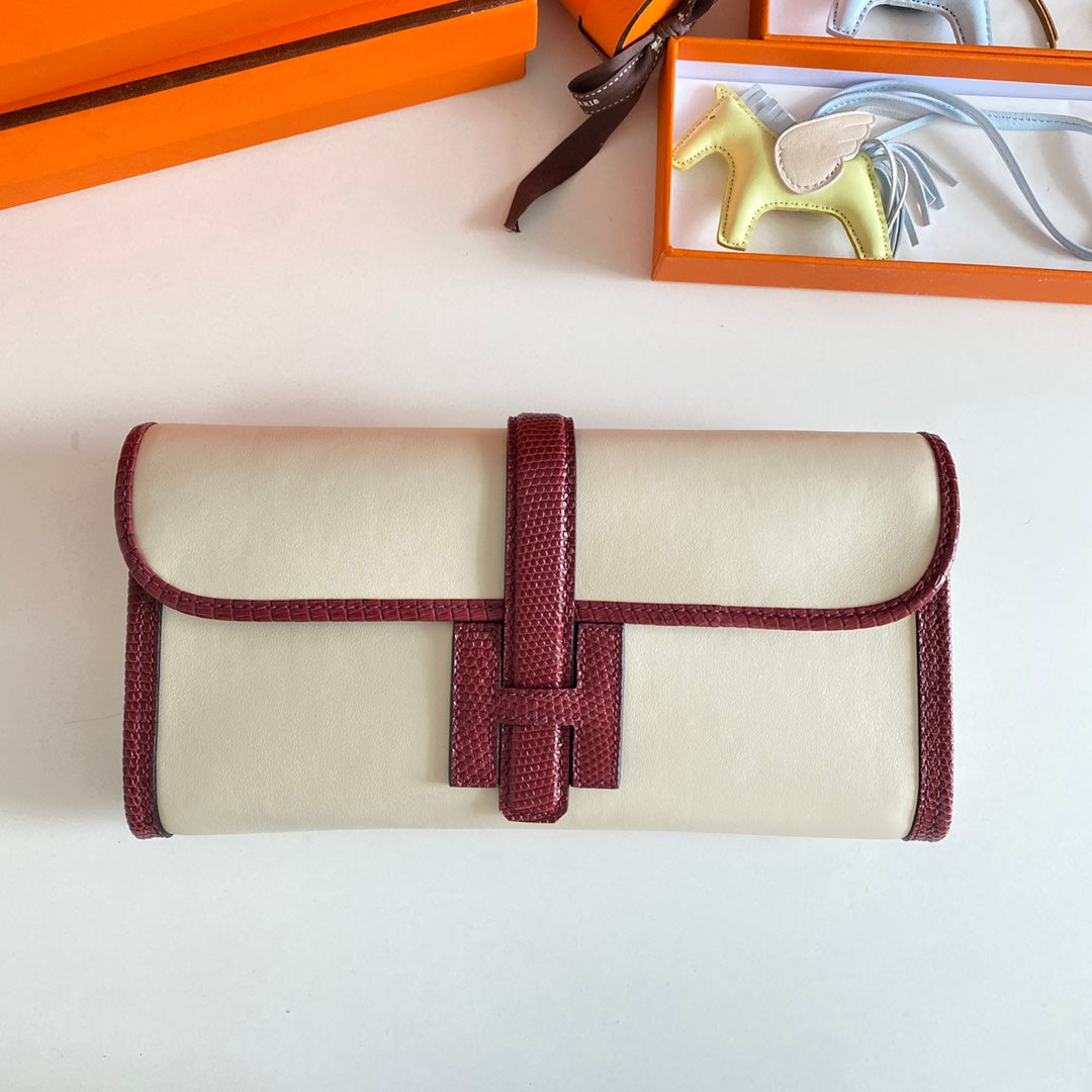JIGE ELAN 29 CLUTCH IN WHITE CALFSKIN WITH GARNET RED LIZARD SKIN