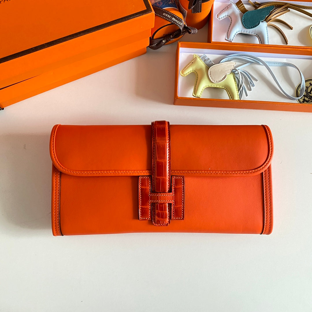 JIGE ELAN 29 CLUTCH IN BRIGHT ORANGE CALFSKIN WITH LIZARD SKIN