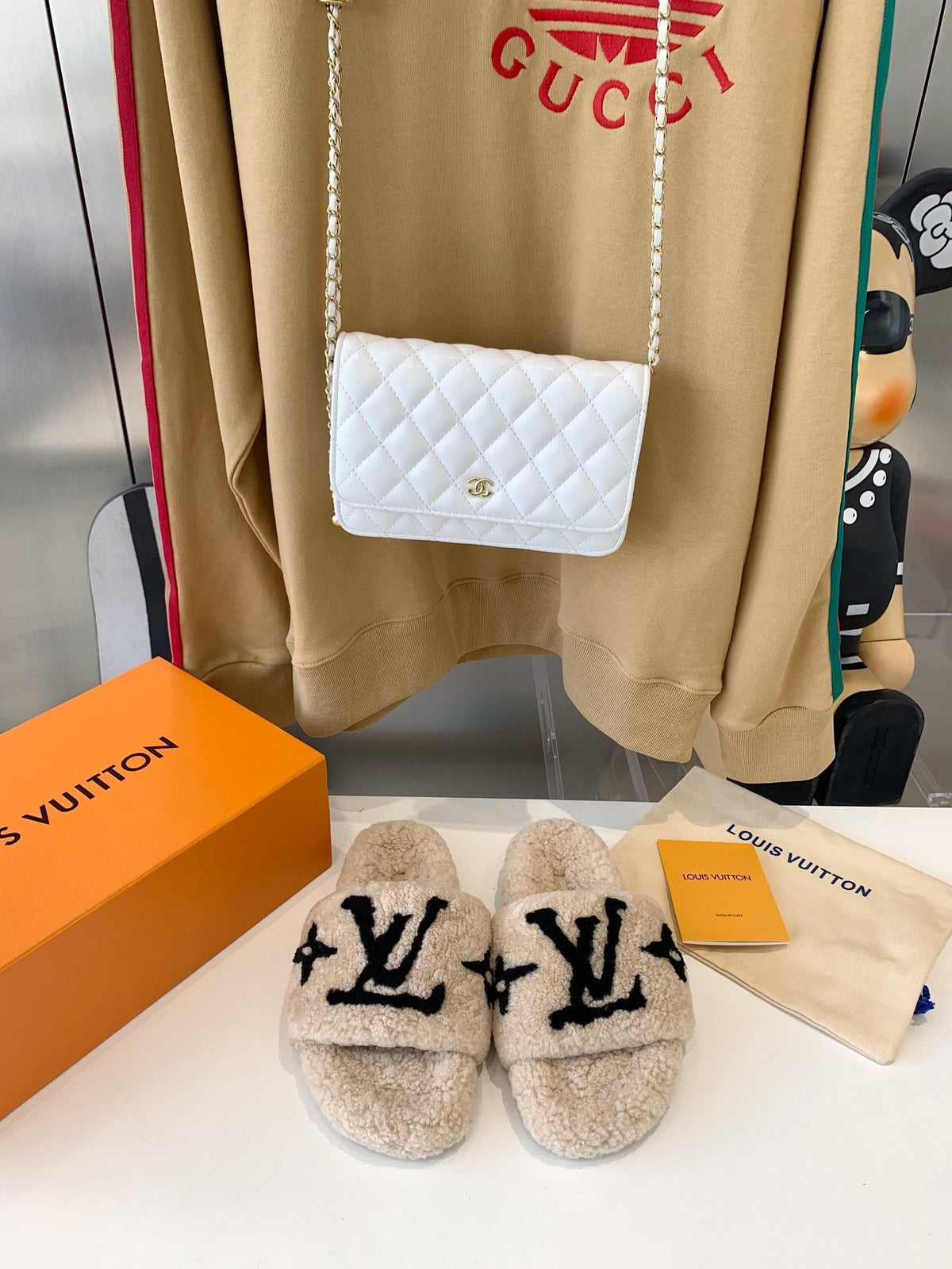 LV WOMEN'S PASEO FLAT SLIPPER IN TAN BROWN FLEECE WITH BLACK LOGO