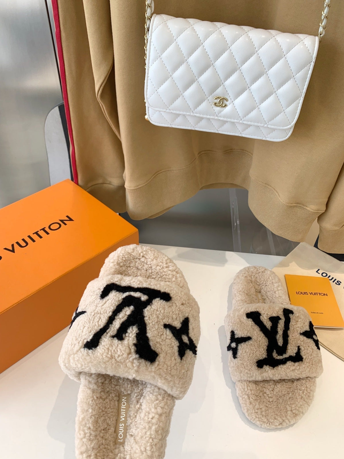 LV WOMEN'S PASEO FLAT SLIPPER IN TAN BROWN FLEECE WITH BLACK LOGO