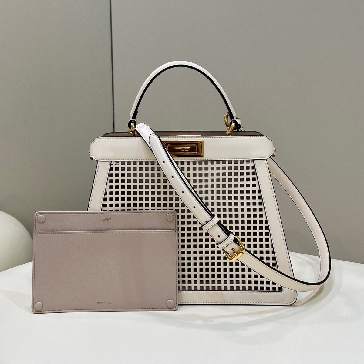 PEEKABOO ISEEU 34 IN WHITE PERFORATED CALFSKIN GOLD HARDWARE