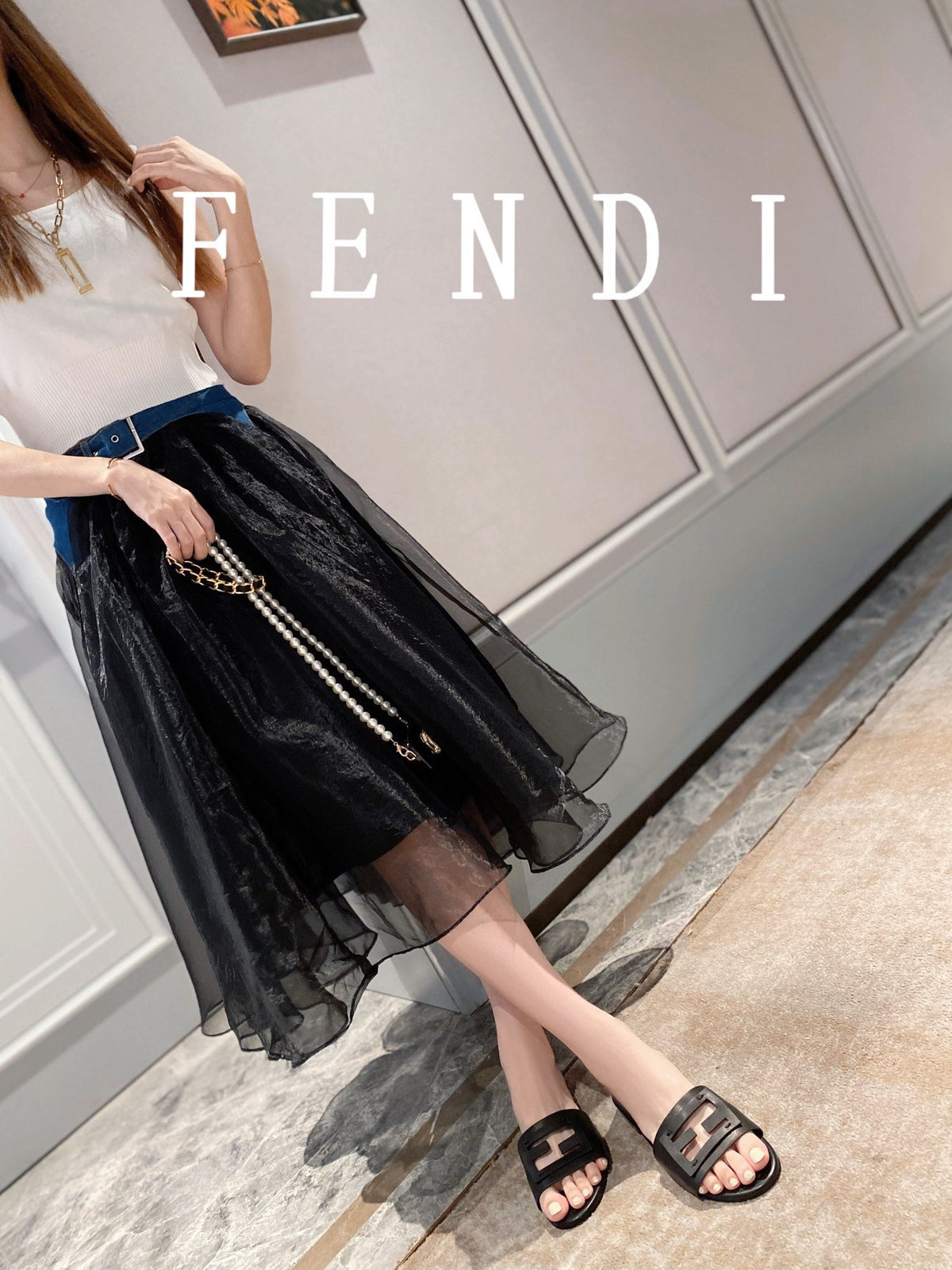 FENDI BAGUETTE SLIDES IN BLACK LAMBSKIN