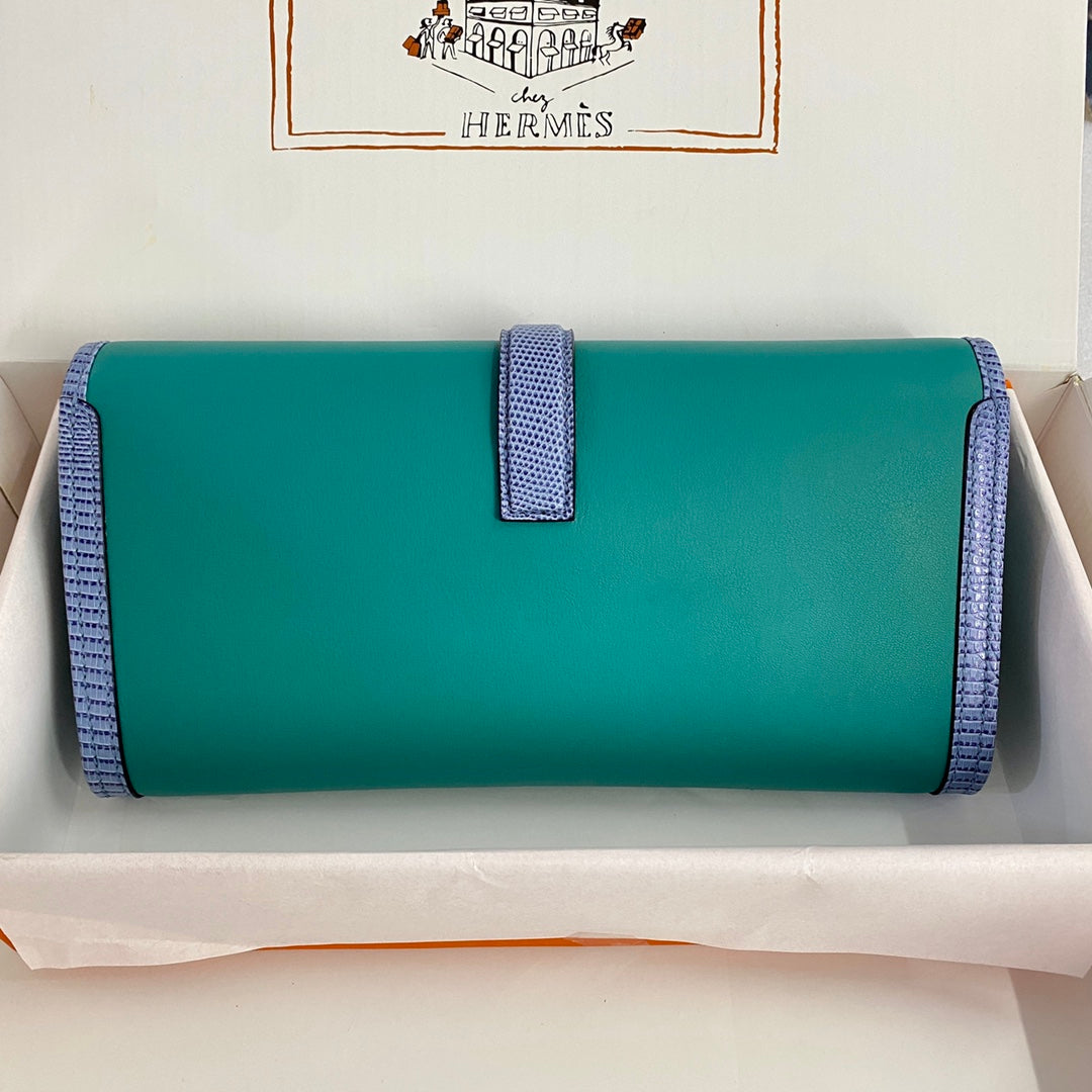 JIGE ELAN 29 CLUTCH IN TEAL GREEN CALFSKIN WITH ROYAL BLUE LIZARD SKIN