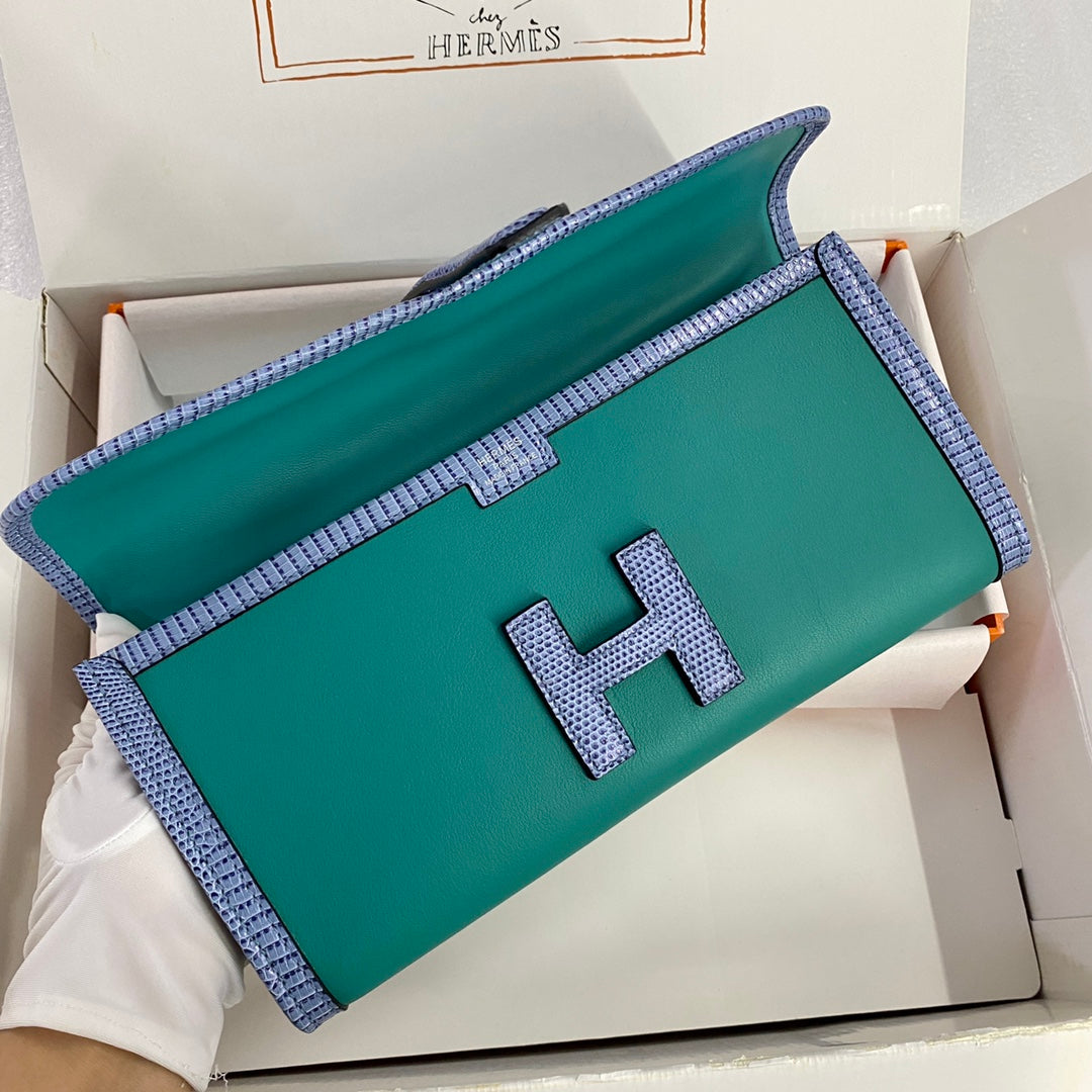 JIGE ELAN 29 CLUTCH IN TEAL GREEN CALFSKIN WITH ROYAL BLUE LIZARD SKIN