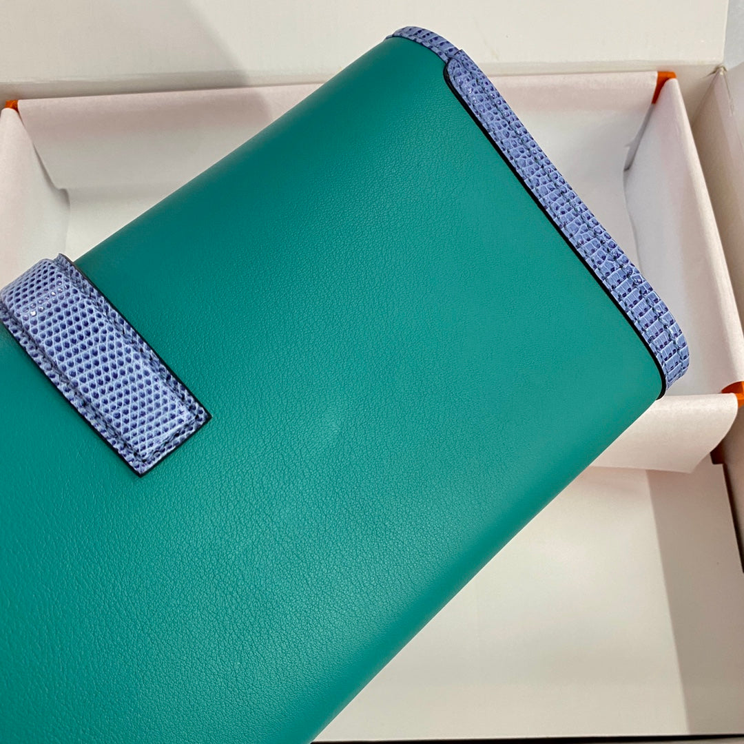 JIGE ELAN 29 CLUTCH IN TEAL GREEN CALFSKIN WITH ROYAL BLUE LIZARD SKIN