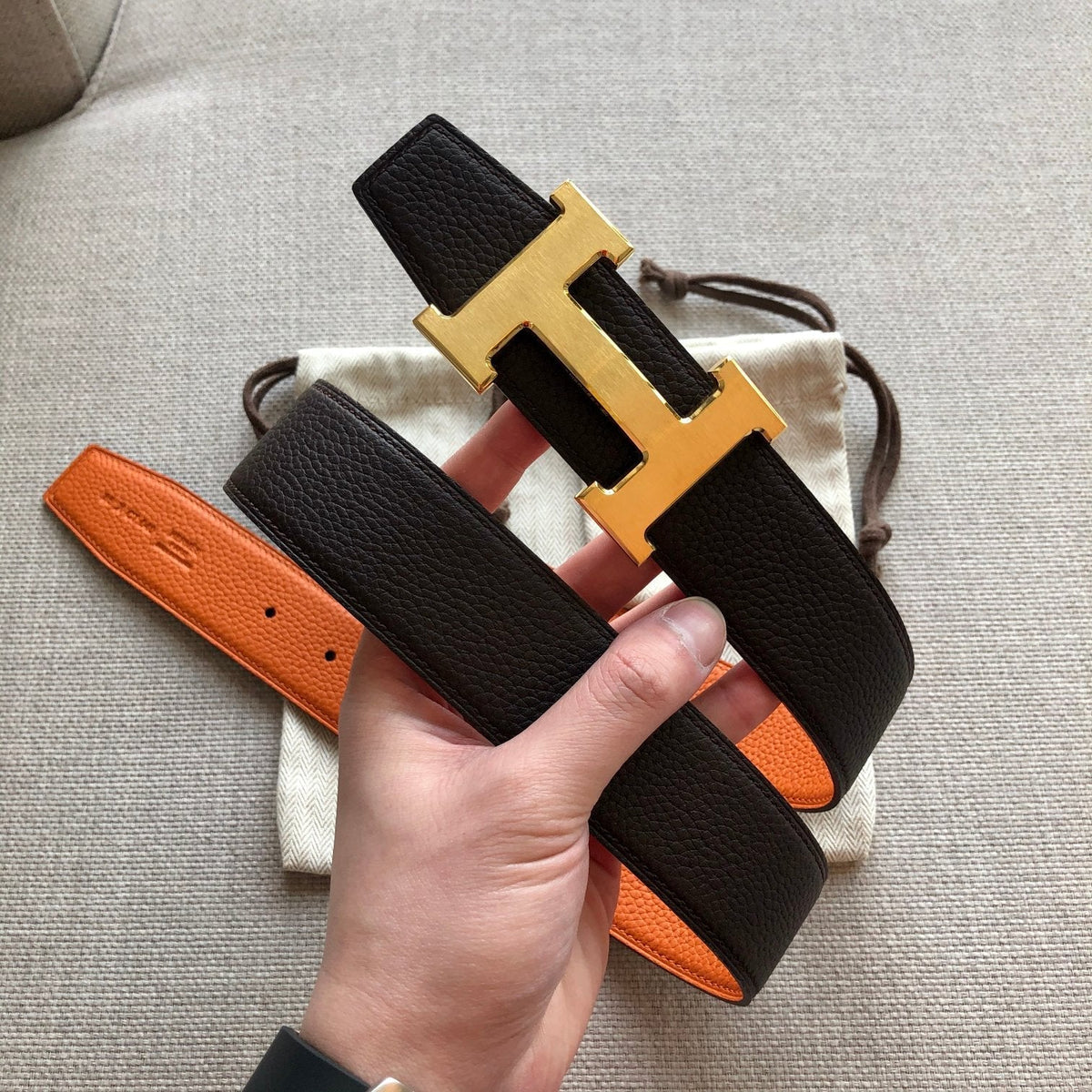 HM BELT BUCKLE & REVERSIBLE BLACK AND ORANGE LEATHER STRAP 38MM GOLD HARDWARE