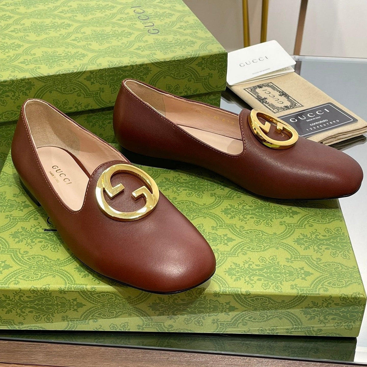 BLONDIE LOGO-PLAQUE LOAFERS IN SYRUP BROWN CALFSKIN WITH GOLD HARDWARE