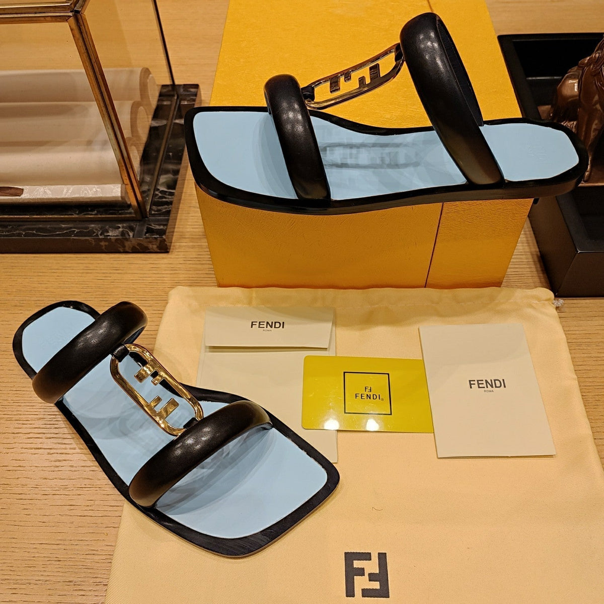 FENDI O'LOCK SLIDES BLACK AND LIGHT BLUE CALFSKIN WITH GOLD HARDWARE