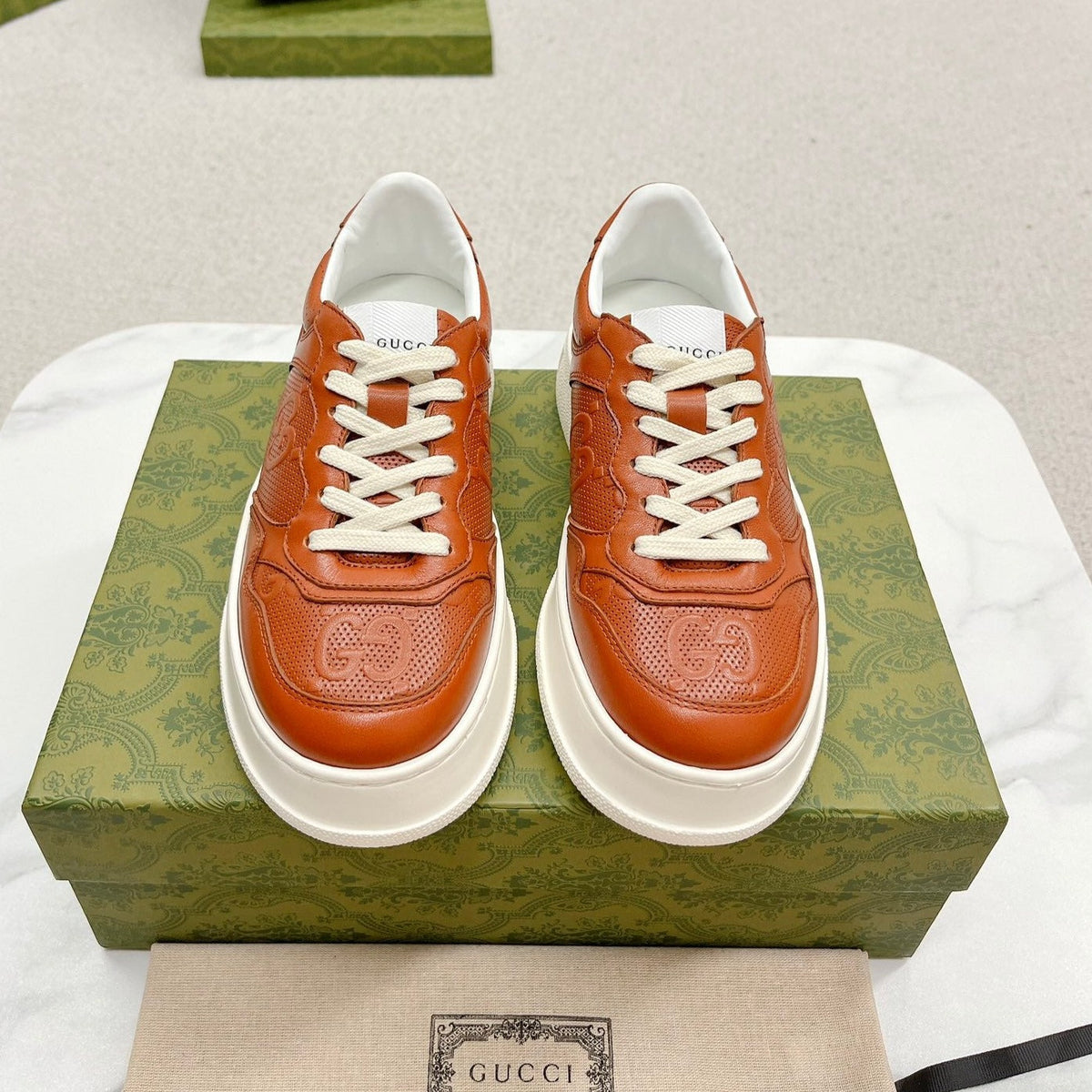 GG EMBOSSED TRAINER CARAMEL CALFSKIN