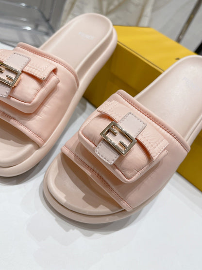 FENDI BAGUETTE SLIPPERS IN PASTEL PINK LAMBSKIN WITH GOLD HARDWARE
