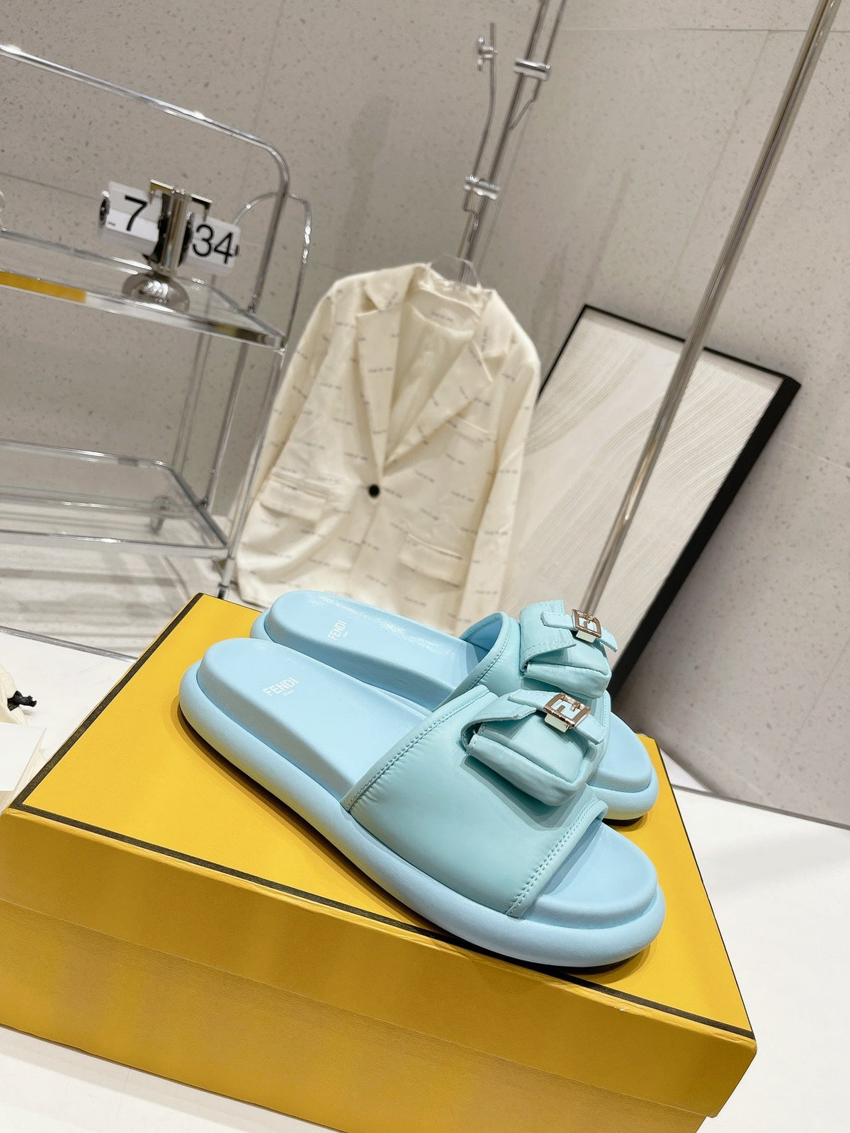 FENDI BAGUETTE SLIPPERS IN SKY BLUE LAMBSKIN WITH GOLD HARDWARE