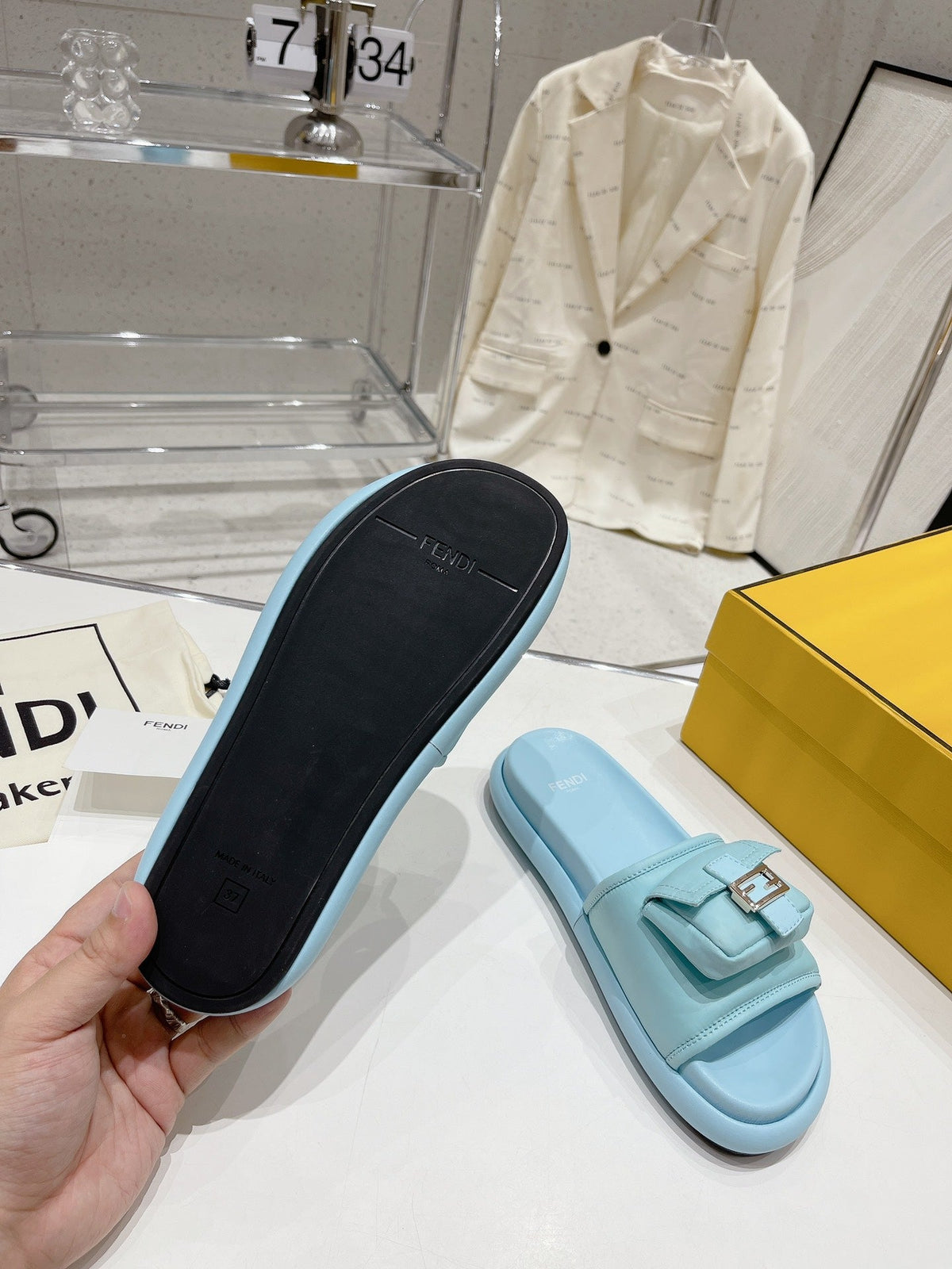 FENDI BAGUETTE SLIPPERS IN SKY BLUE LAMBSKIN WITH GOLD HARDWARE