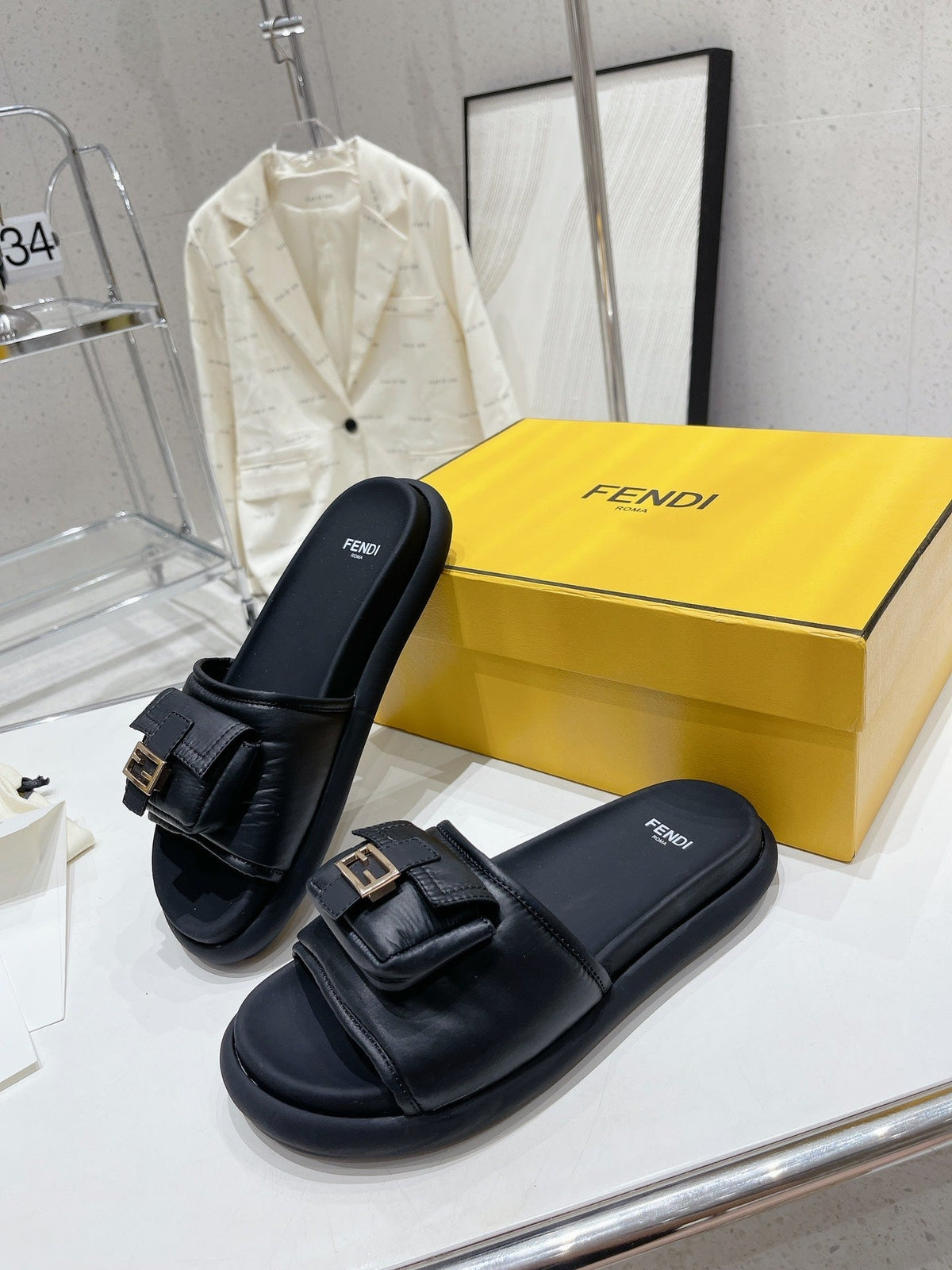 FENDI BAGUETTE SLIPPERS IN BLACK LAMBSKIN WITH GOLD HARDWARE