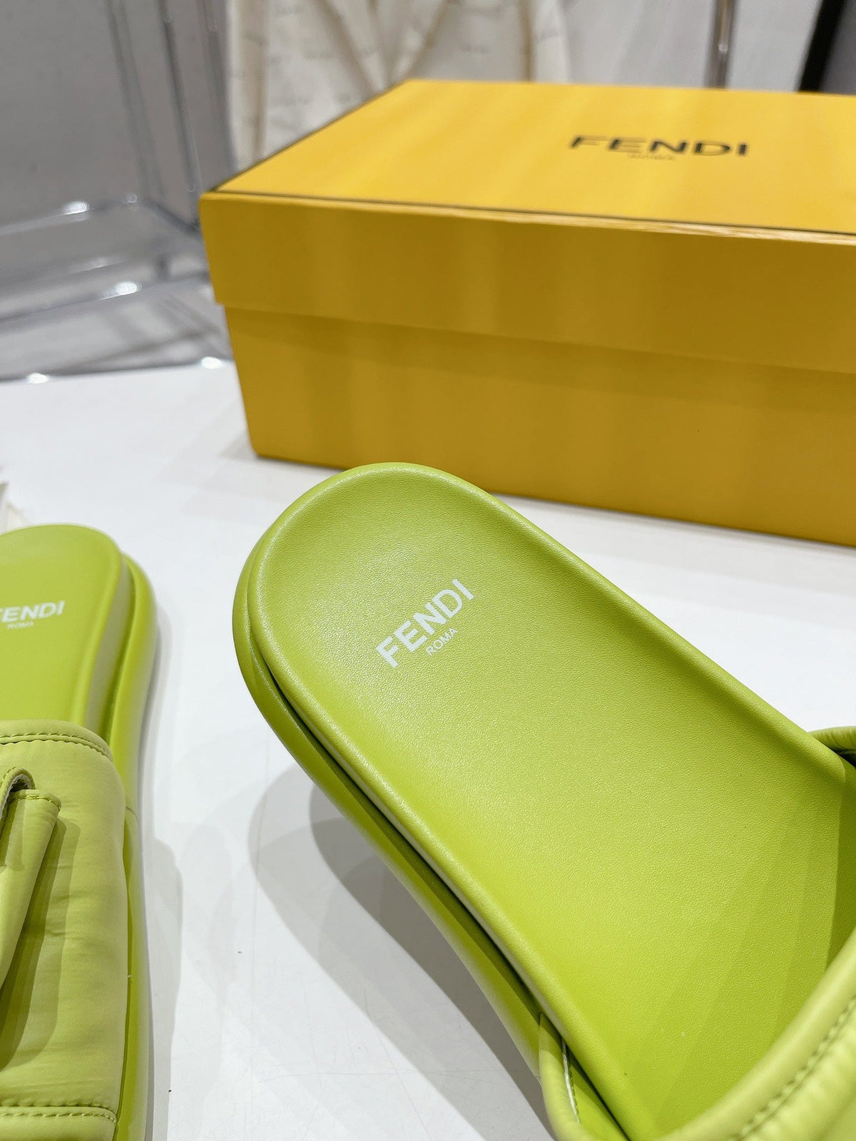 FENDI BAGUETTE SLIPPERS IN PEAR GREEN LAMBSKIN WITH GOLD HARDWARE