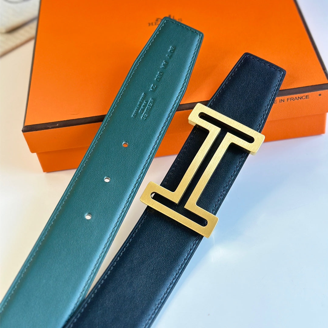 HM  BELT BUCKLE & REVERSIBLE TEAL GREEN AND BLACK LEATHER STRAP 38MM GOLD HARDWARE