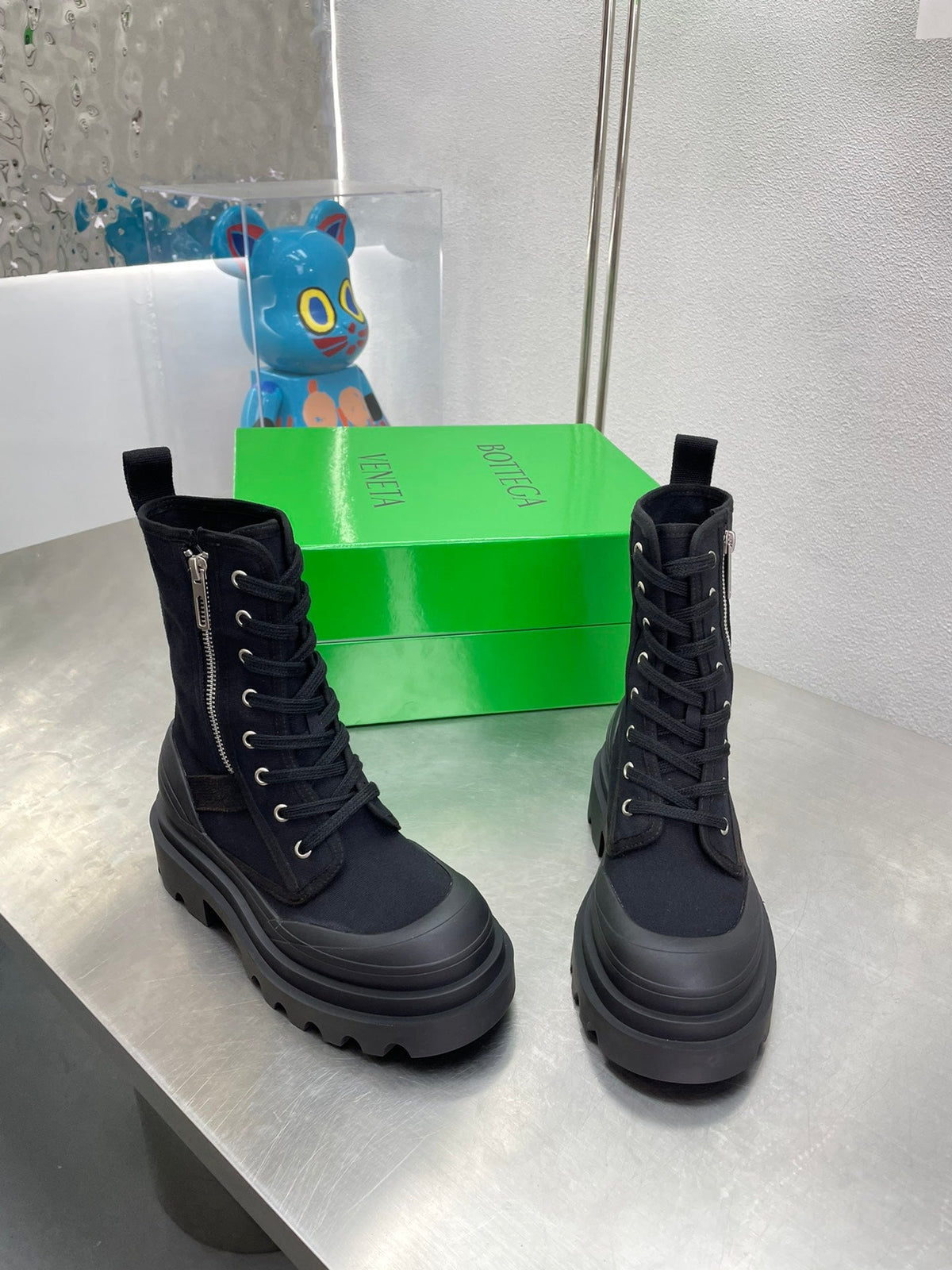 RIBBON BOMBER LACE-UP BOOTS IN BLACK CANVAS