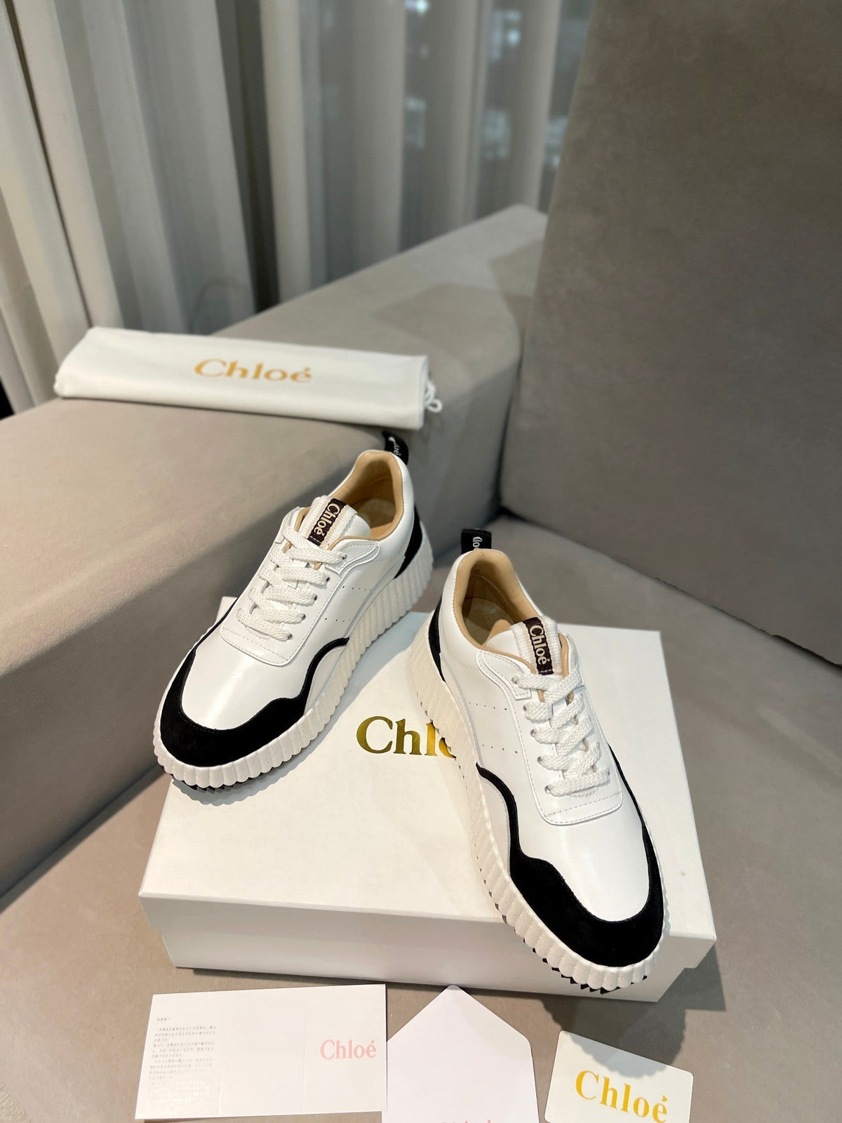 NAMA SNEAKER IN WHITE LAMBSKIN AND BLACK SUEDE