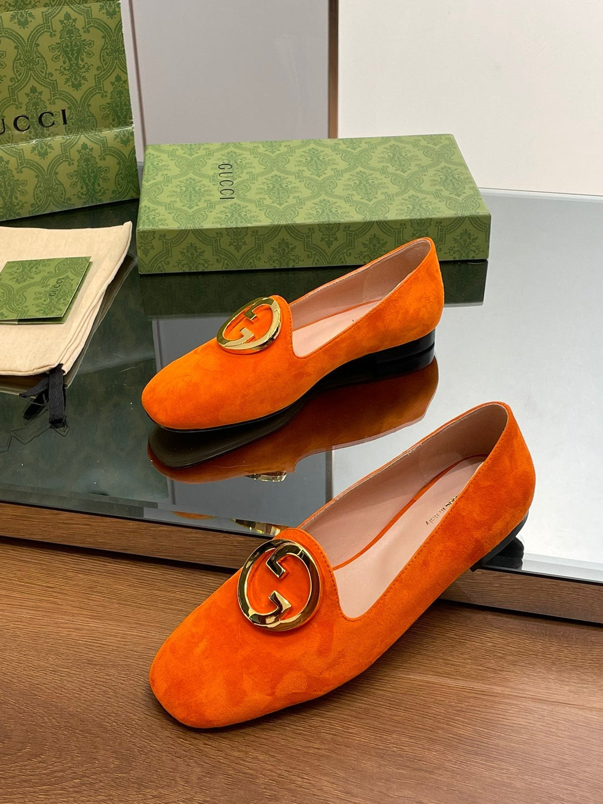 BLONDIE LOGO-PLAQUE LOAFERS IN TIGER ORANGE SUEDE WITH GOLD HARDWARE