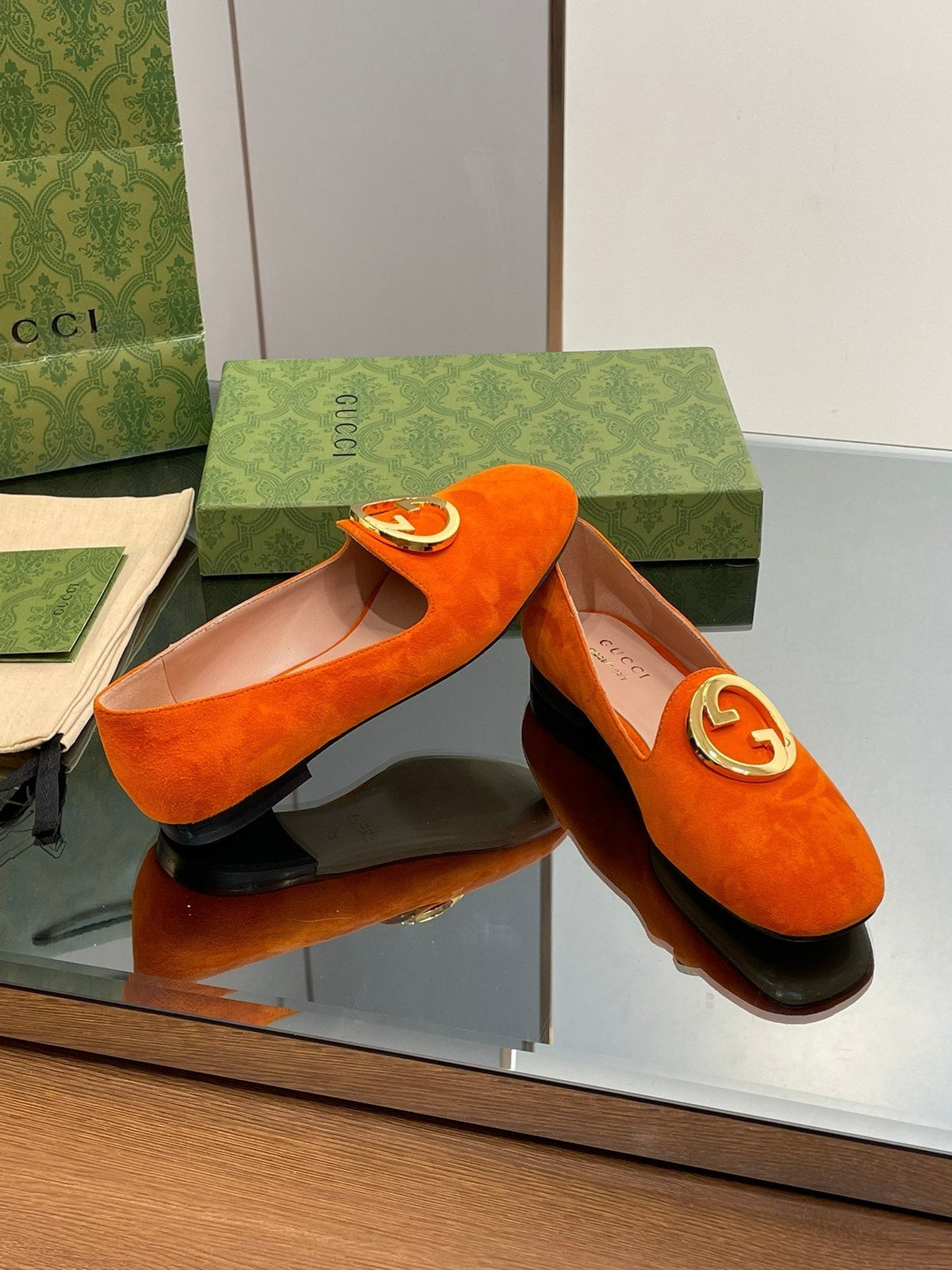 BLONDIE LOGO-PLAQUE LOAFERS IN TIGER ORANGE SUEDE WITH GOLD HARDWARE