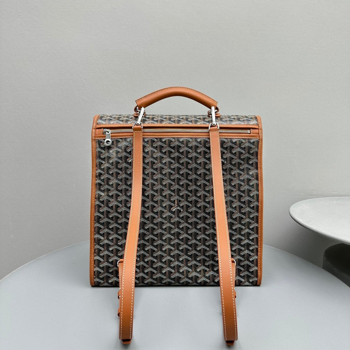 LEGER BACKPACK 37 IN BLACK GOYARDINE CANVAS WITH TAN CALFSKIN TRIM