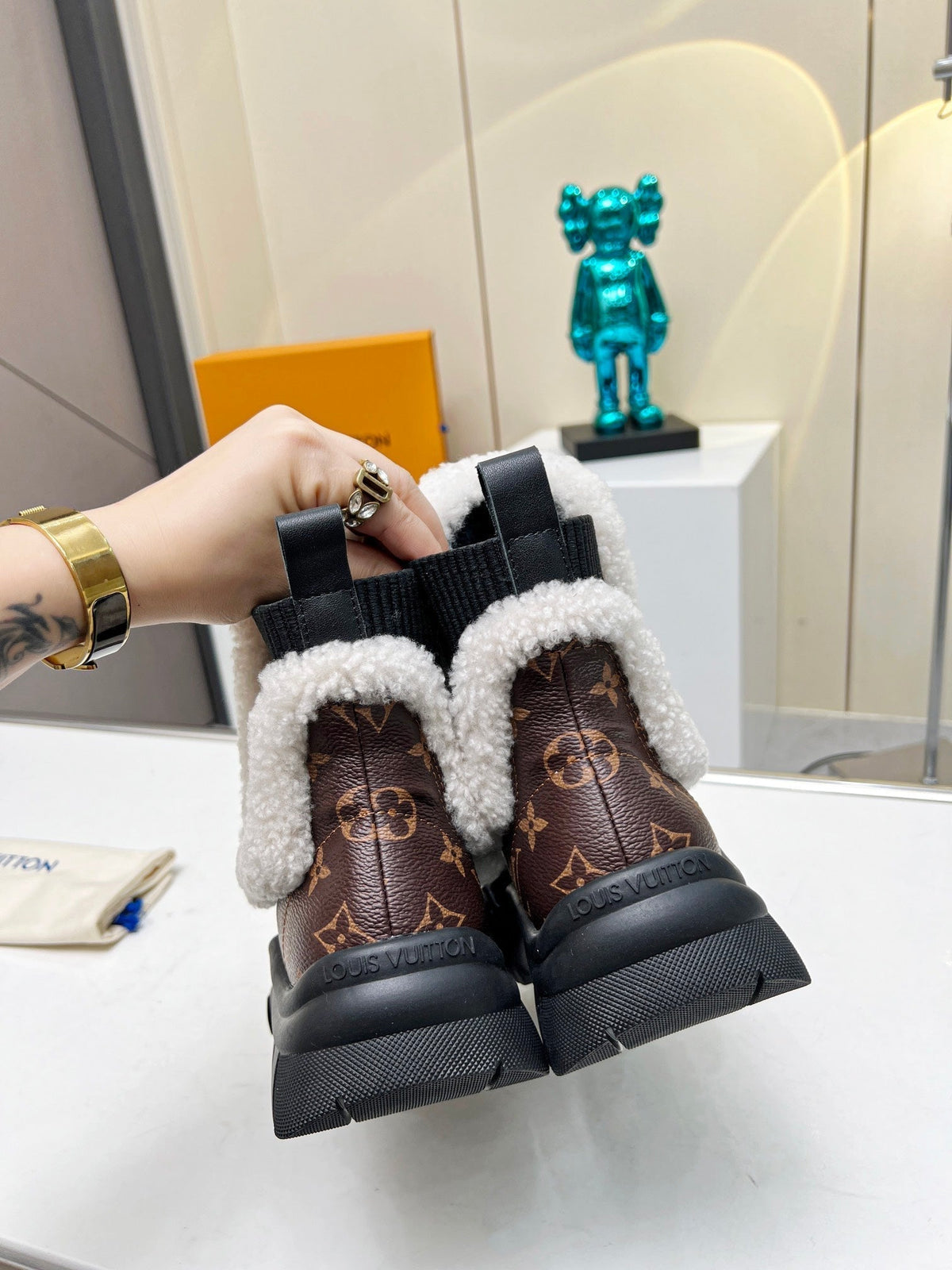 LV RUBY FLAT ANKLE BOOT IN CHOCOLATE BROWN MONOGRAM CALFSKIN AND WHITE SHEARLING