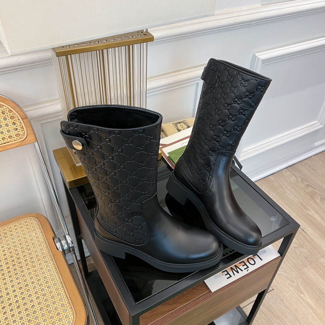 GG EMBOSSED LEATHER ANKLE BOOTS IN BLACK CALFSKIN