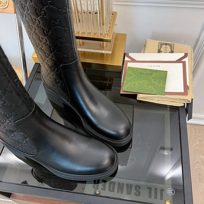 GG EMBOSSED LEATHER ANKLE BOOTS IN BLACK CALFSKIN