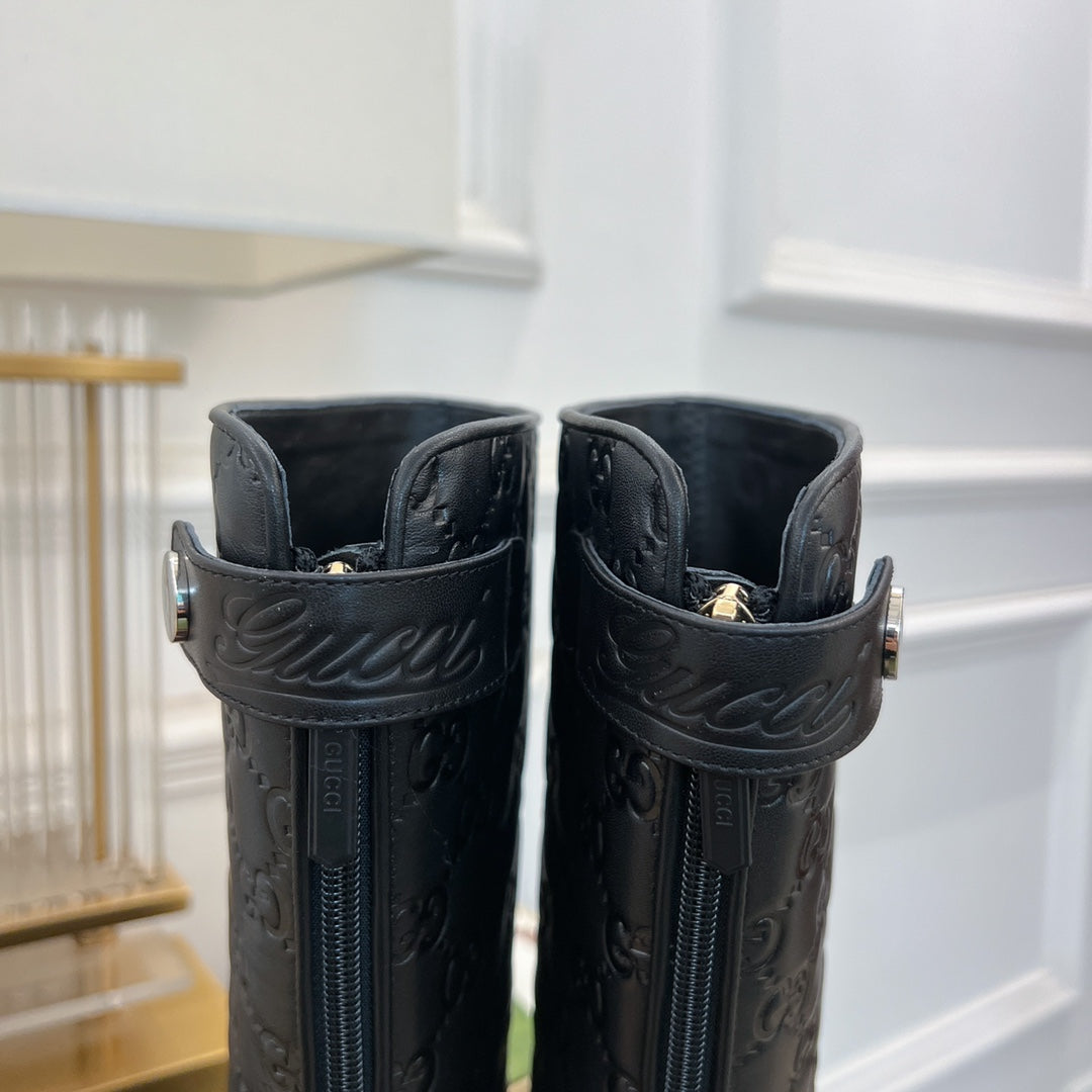 GG EMBOSSED LEATHER ANKLE BOOTS IN BLACK CALFSKIN