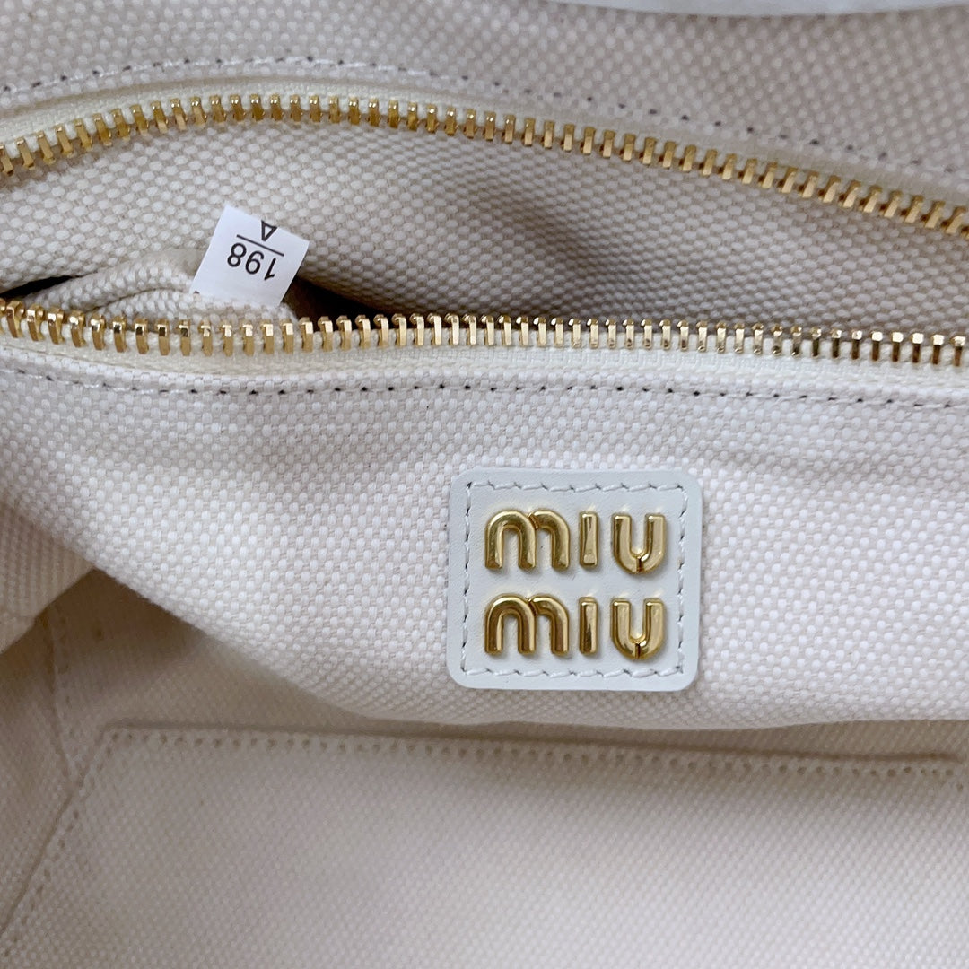 IVY HANDBAG 22 IN WHITE CANVAS
