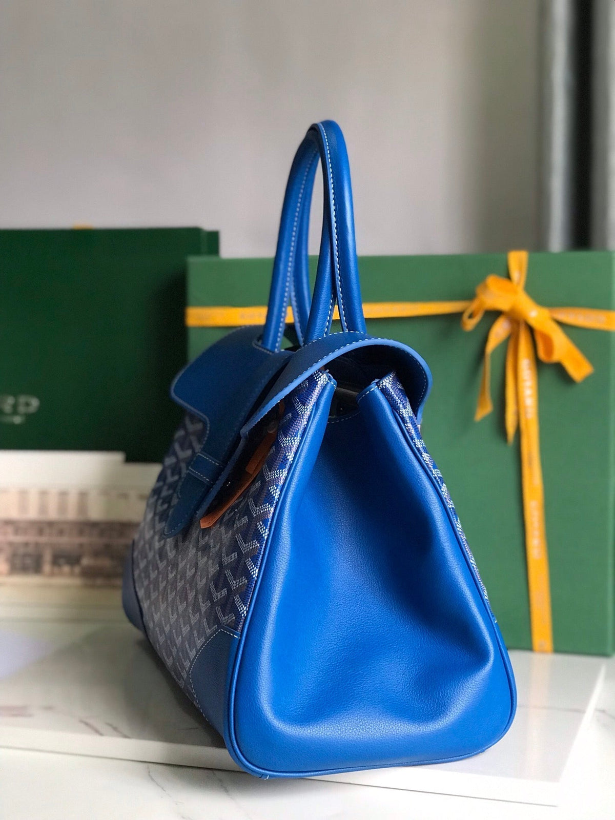 SAIGON SOUPLE BAG 34 IN CURIOUS BLUE GOYARDINE CANVAS AND CALFSKIN