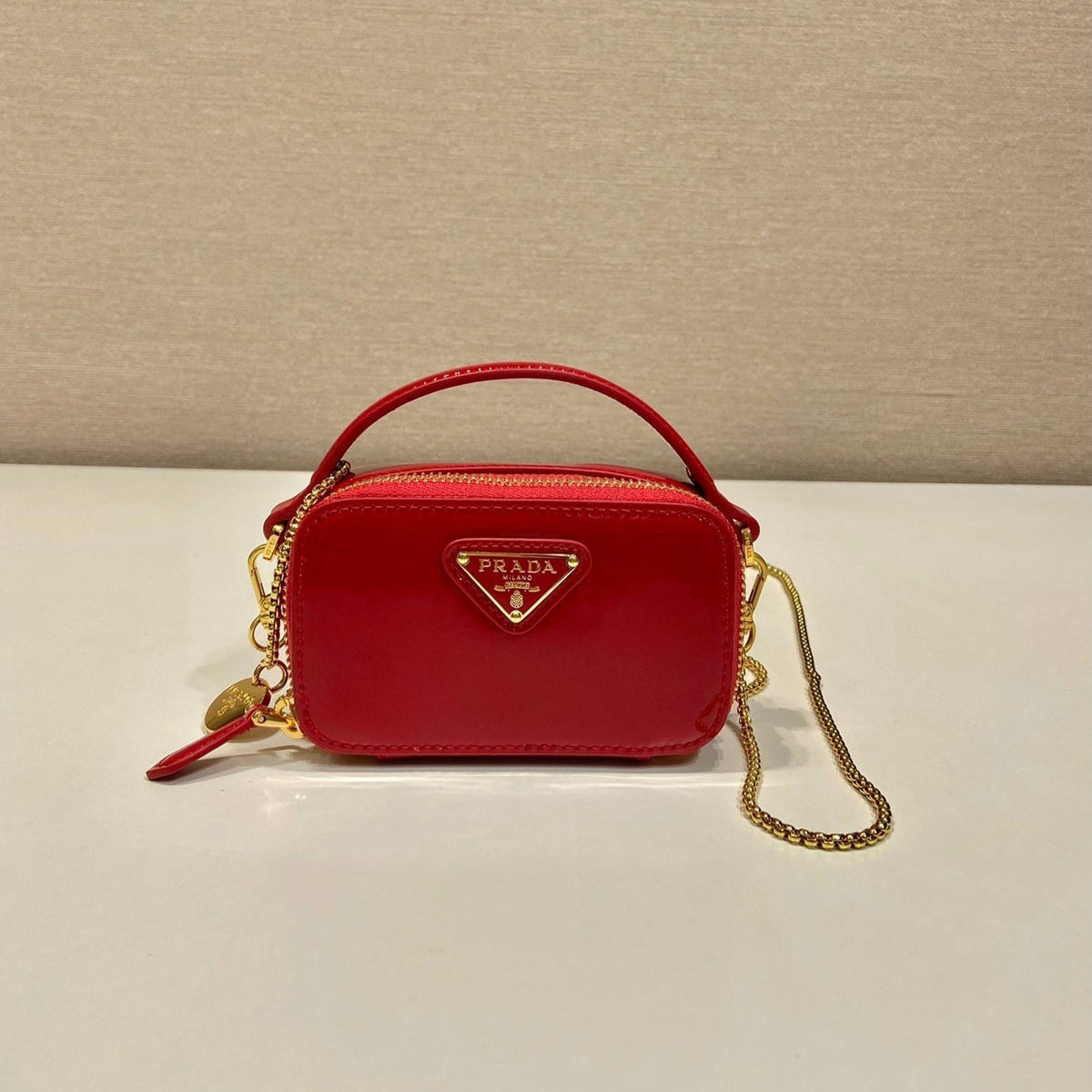 MINI HAND BAG 11 WITH GOLD STRAP IN RED PATENT CALFSKIN