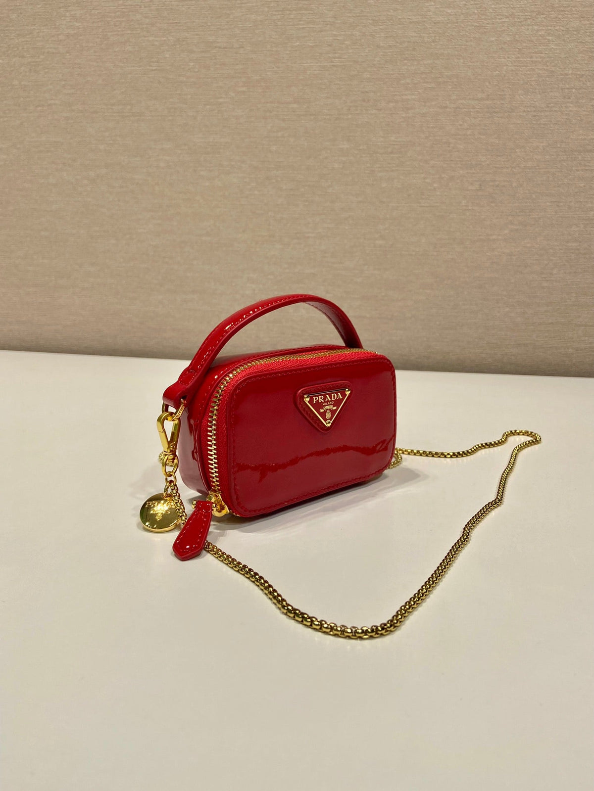 MINI HAND BAG 11 WITH GOLD STRAP IN RED PATENT CALFSKIN