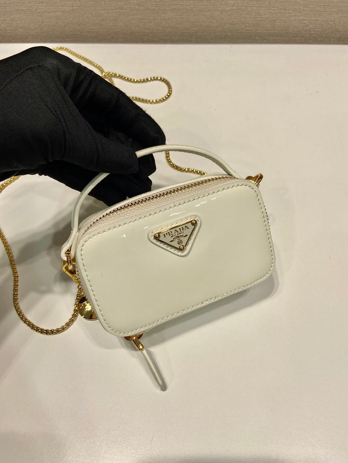 MINI HAND BAG 11 WITH GOLD STRAP IN WHITE PATENT CALFSKIN