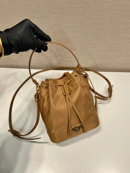 BUCKET BAG 19 IN RUSSET BROWN RE-NYLON AND CALFSKIN HANDLE