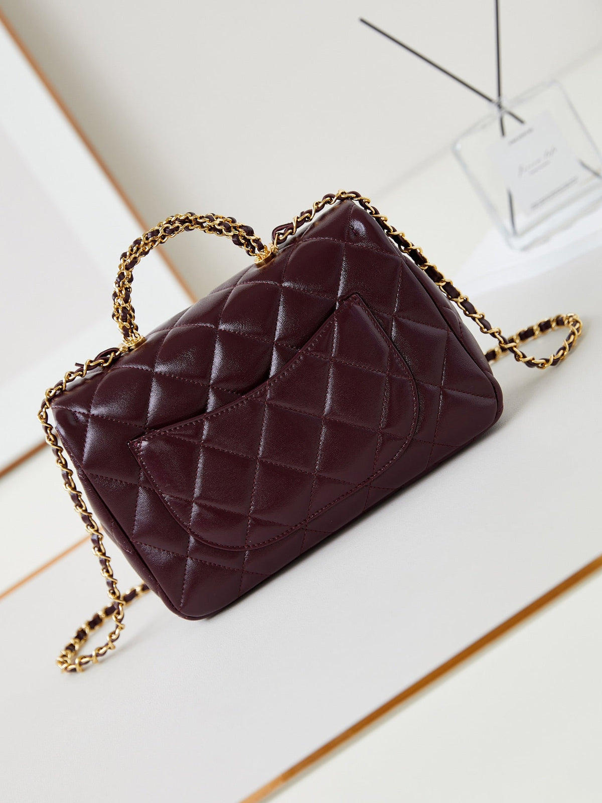 FLAP BAG WITH TOP HANDLE 25 IN WINE RED OIL-WAX LAMBSKIN GOLD HARDWARE