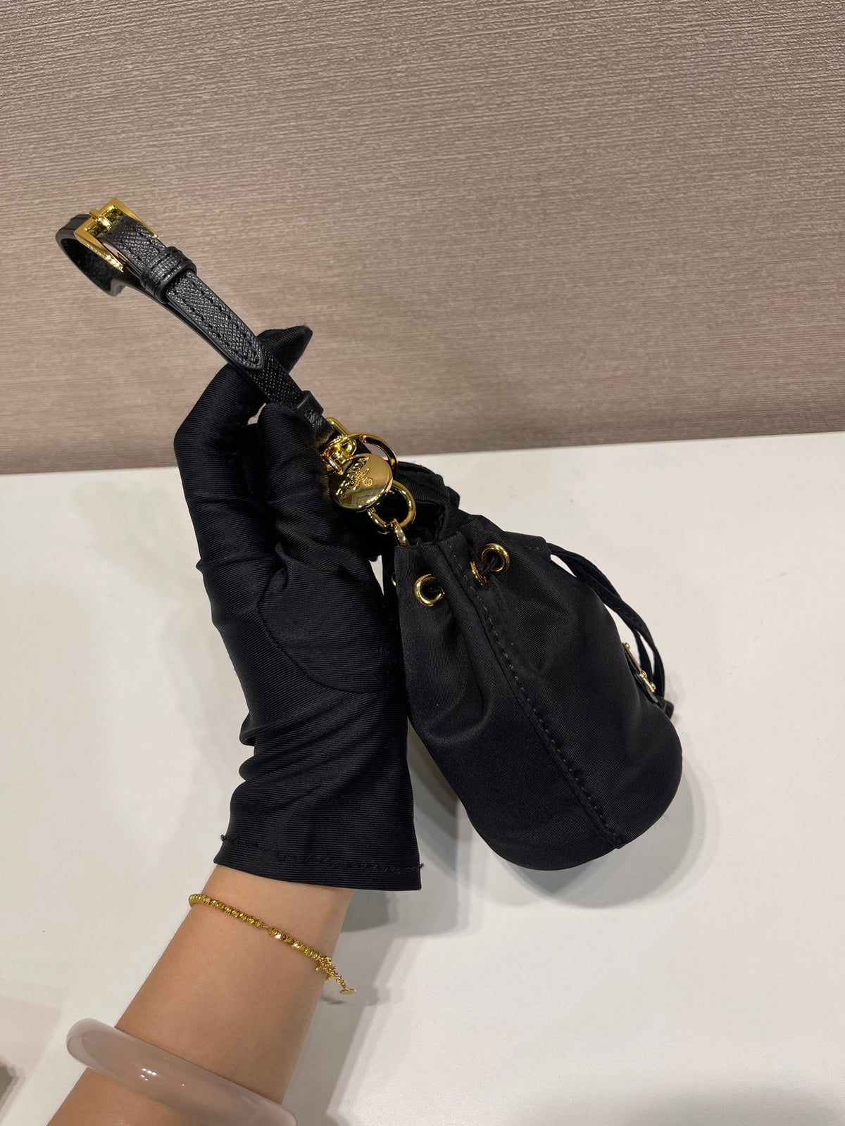 MINI BUCKET BAG 10 IN BLACK RE-NYLON AND SAFFIANO LEATHER STRAP