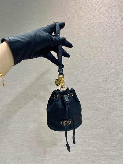 MINI BUCKET BAG 10 IN BLACK RE-NYLON AND SAFFIANO LEATHER STRAP