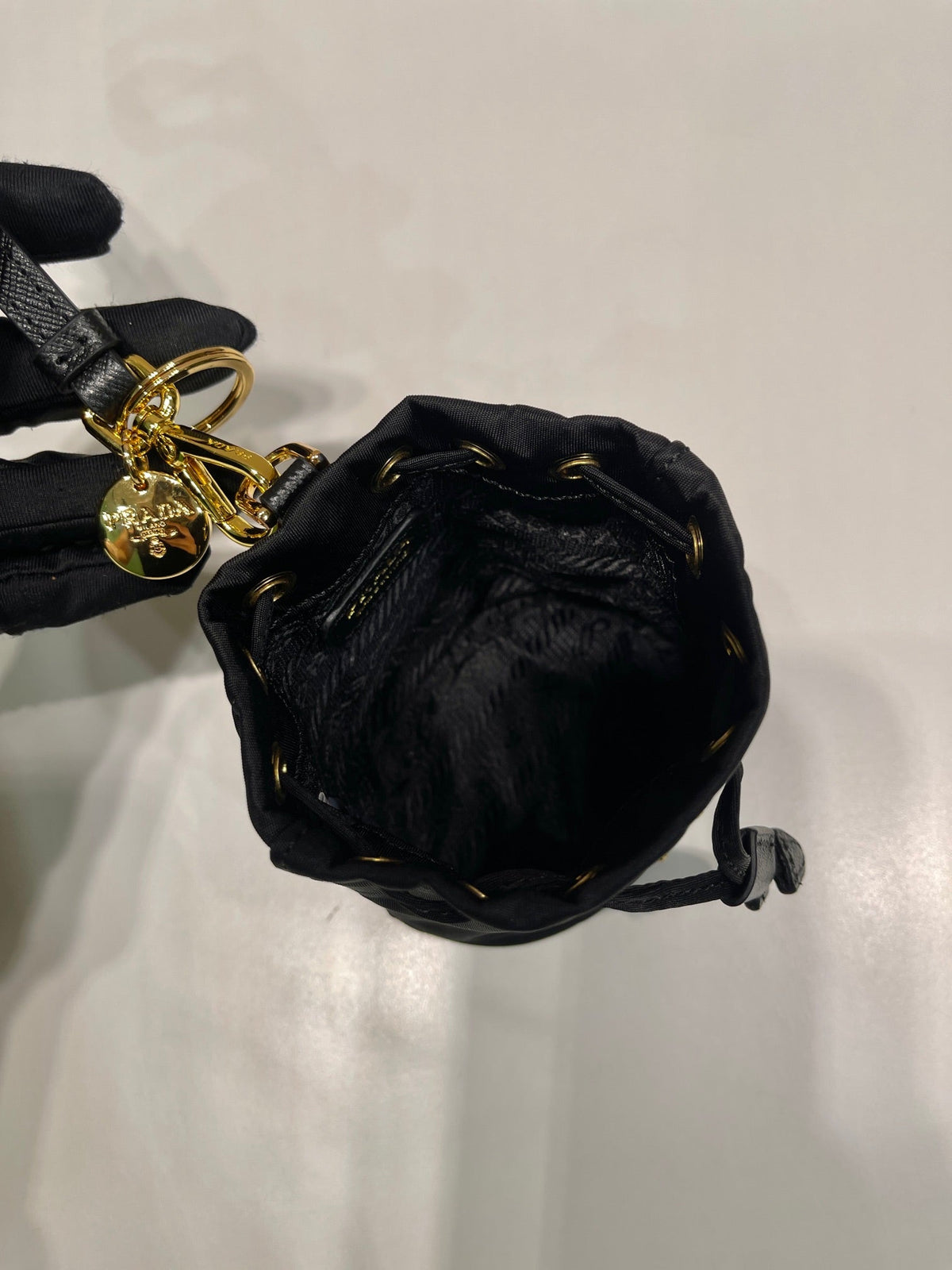 MINI BUCKET BAG 10 IN BLACK RE-NYLON AND SAFFIANO LEATHER STRAP