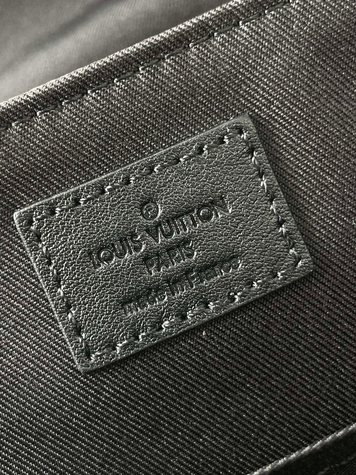 MESSENGER VOYAGER PM 33 IN GUN METAL MONOGRAM ECLIPSE CANVAS