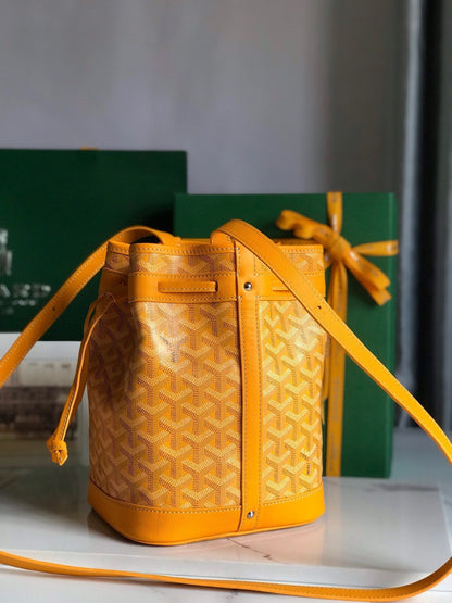 PETIT FLOT BUCKET BAG 22 IN YELLOW GOYARDINE CANVAS AND LAMBSKIN TRIM