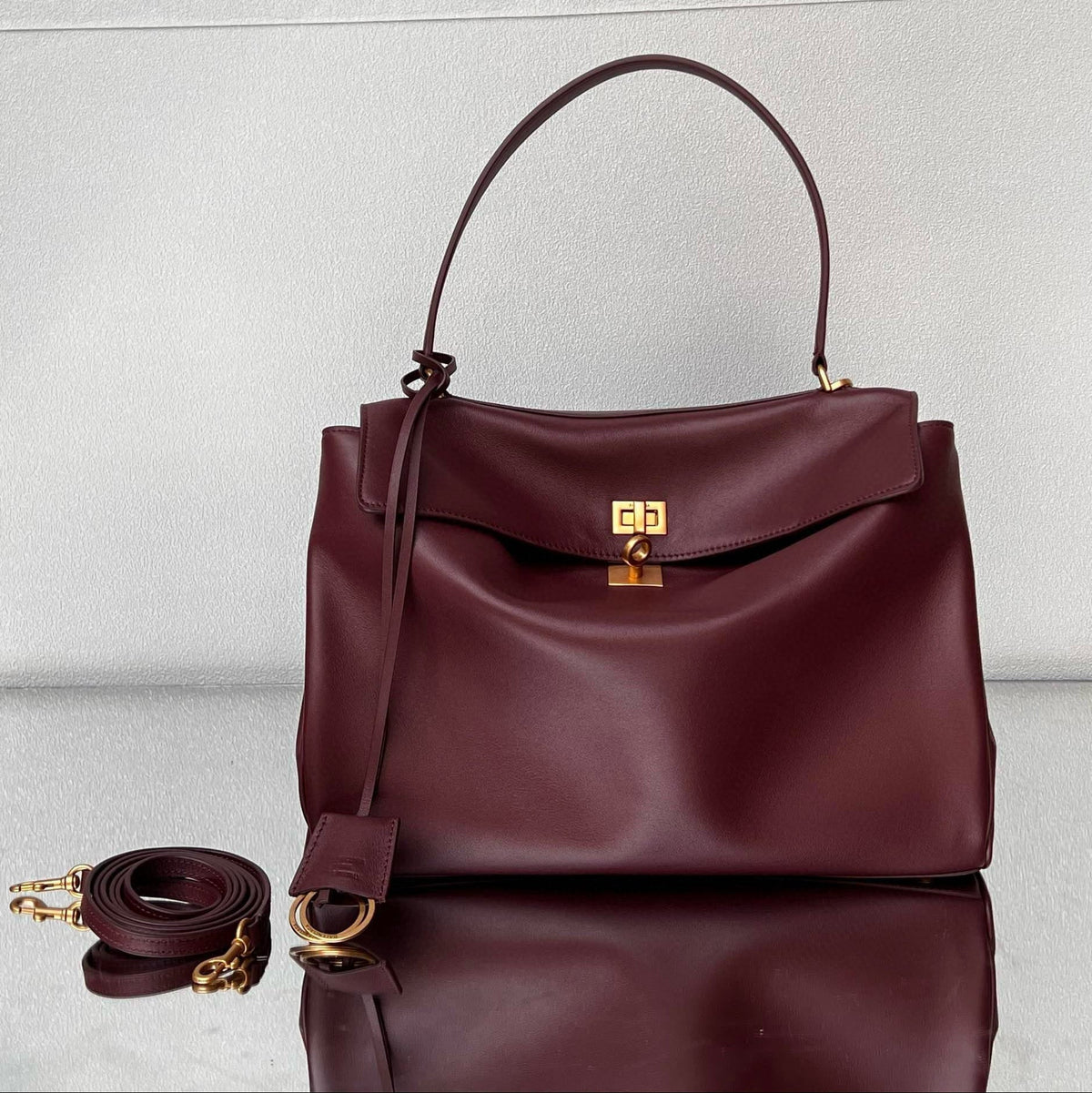 RODEO MEDIUM BAG 35 IN BURGUNDY SMOOTH CALFSKIN GOLD HARDWARE