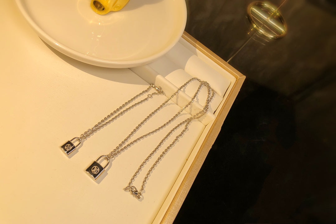 LV CHARITY LOCK NECKLACE