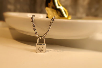 LV CHARITY LOCK NECKLACE